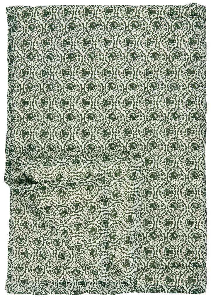 Dark green and white floral quilted throw with myrtle design from Source for the Goose, Devon. Cozy and stylish home accent.