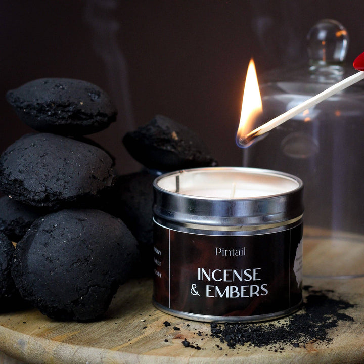 Pintail Candles Incense & Embers Classic Tin Candle being lit, hand-poured in Devon and available at Source for the Goose.