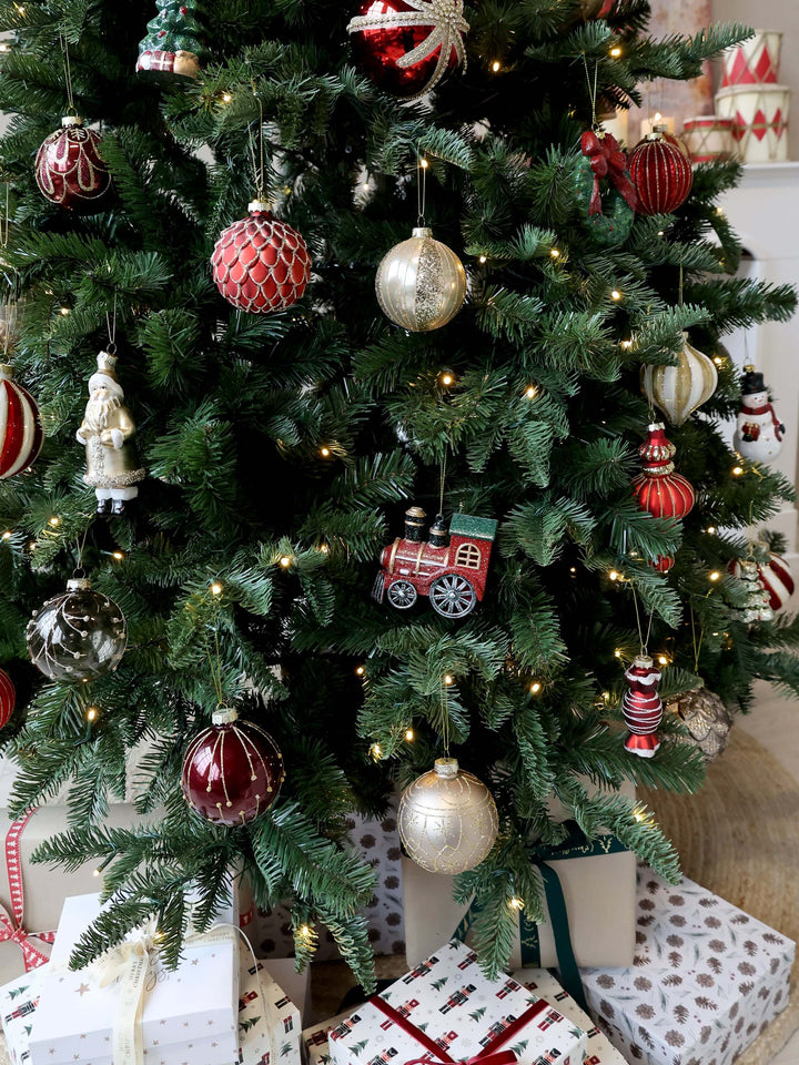 Antique Cherry Red Glass Bauble hanging among other Christmas decorations on a tree at Source for the Goose, Devon