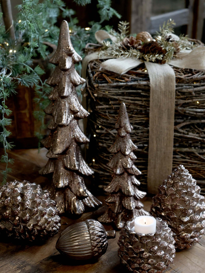 collection of bronze or mocha coloured decorations including an acorn for sale at Source for the Goose, Devon