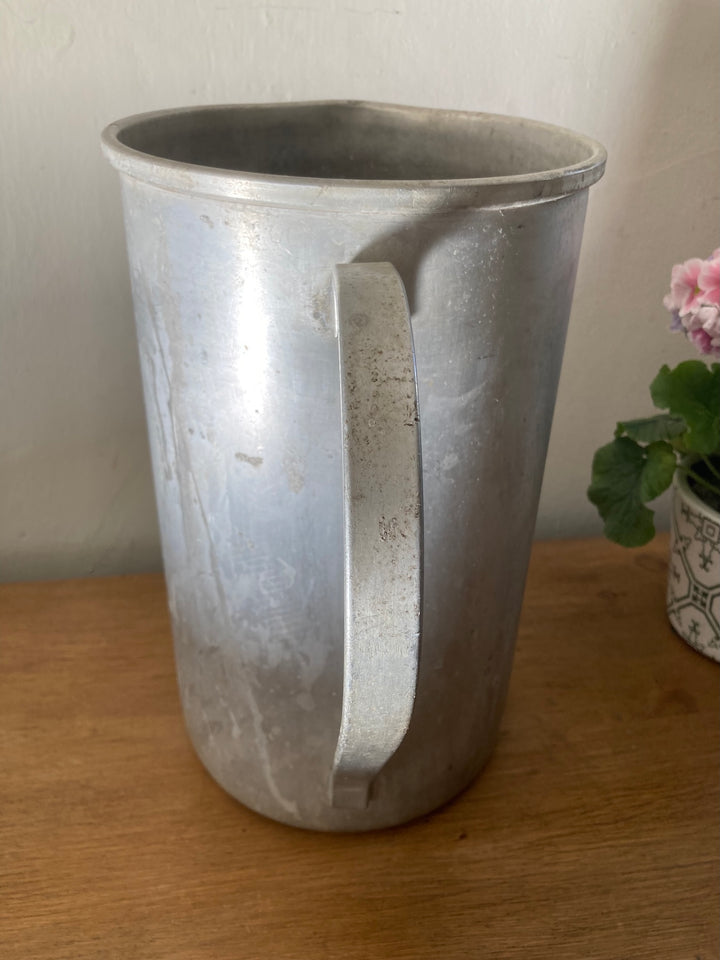 Vintage tall aluminium jug from Source for the Goose, perfect for displaying flowers or adding charm to your kitchen.