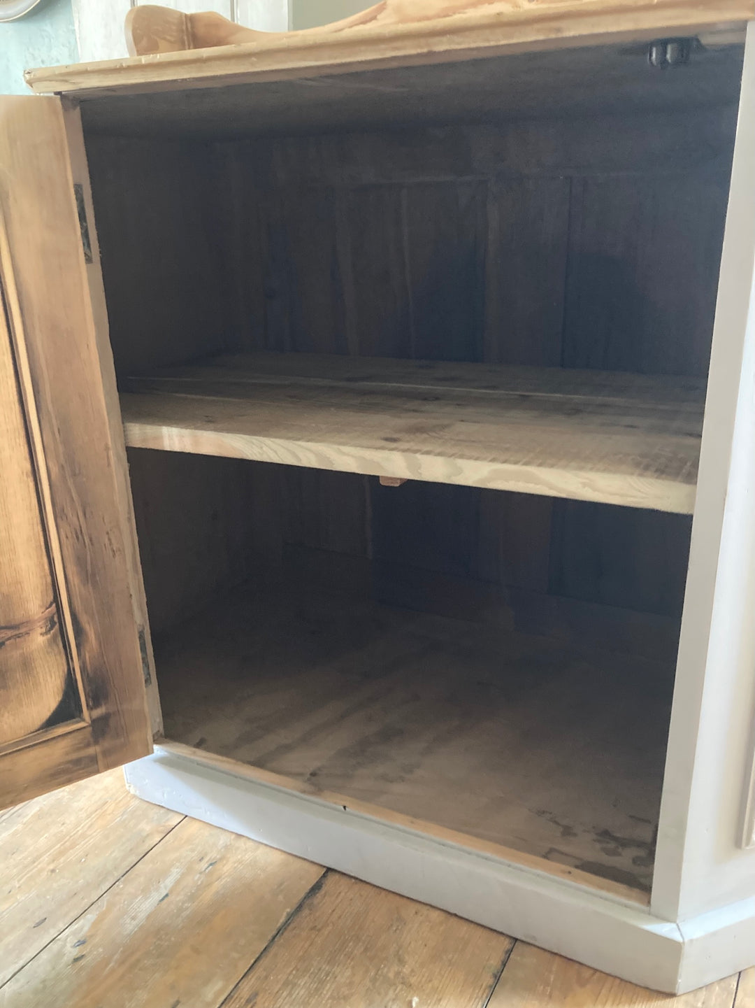 Interior view of the Vintage Pantry Cupboard with two shelves and wooden finish, designed for cozy kitchen storage.