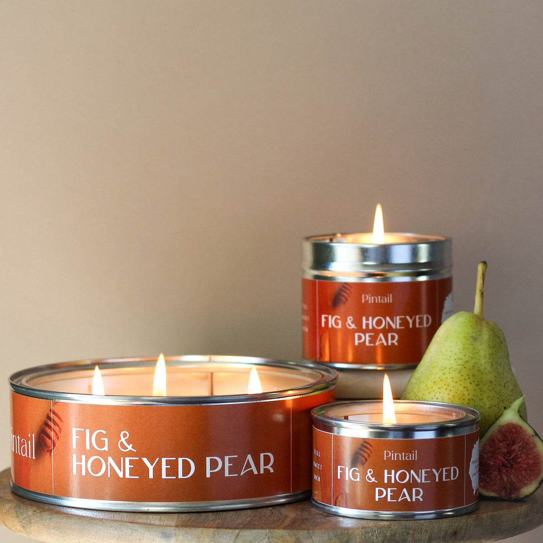 Pintail Fig & Honeyed Pear Triple Wick Candle with fresh figs and pear next to Source for the Goose, Devon