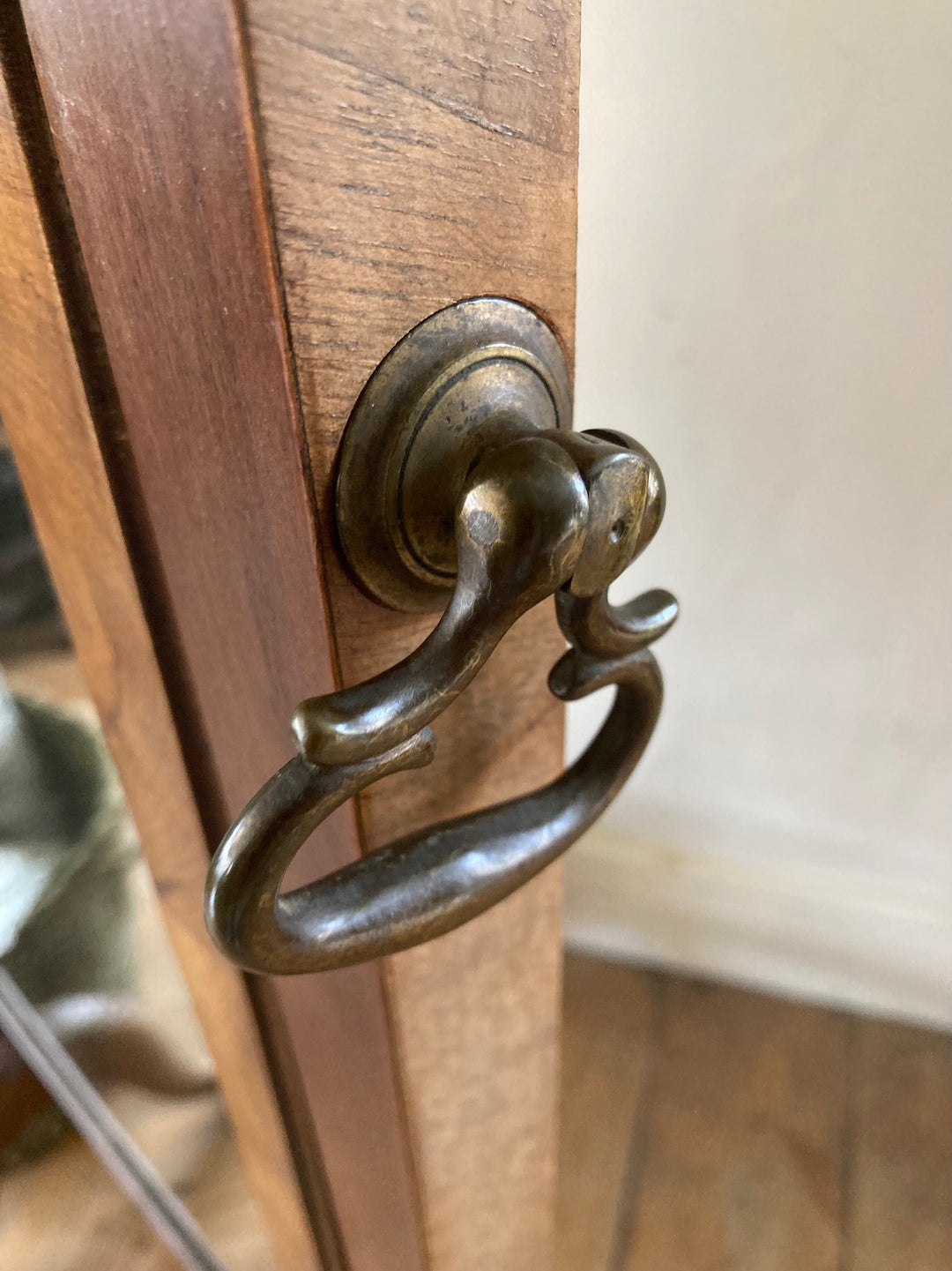 Close-up of the brass handle on an Antique Edwardian Cheval Mirror, showcasing elegant design and craftsmanship.