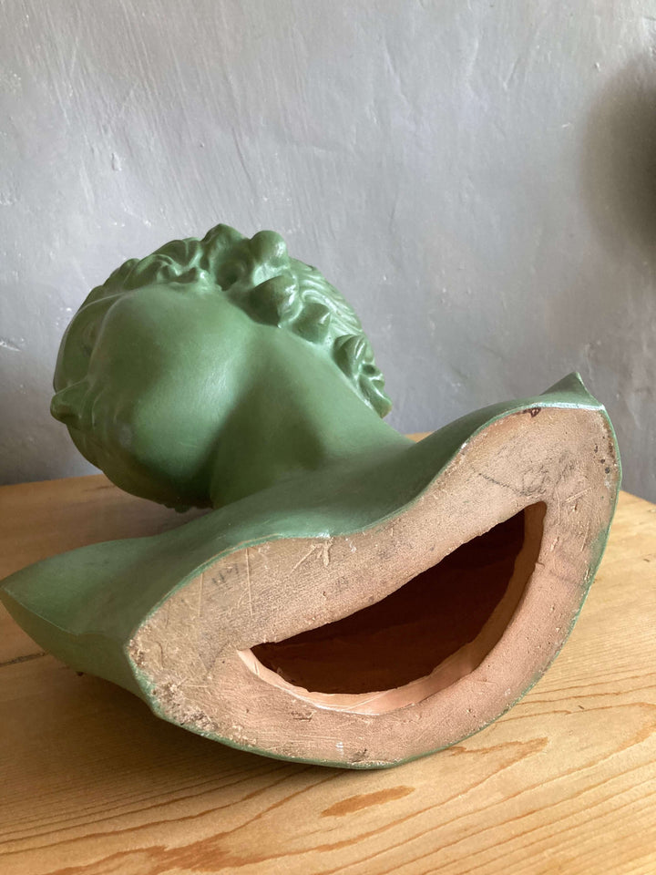 Art Deco Green Ceramic Lady's Head sculpture, Terre Cuite D'Art, vintage French piece from Source for the Goose, Devon, on a table.