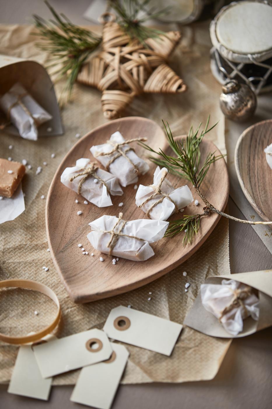 Acacia Wood heart bowl filled with small Christmas parcels