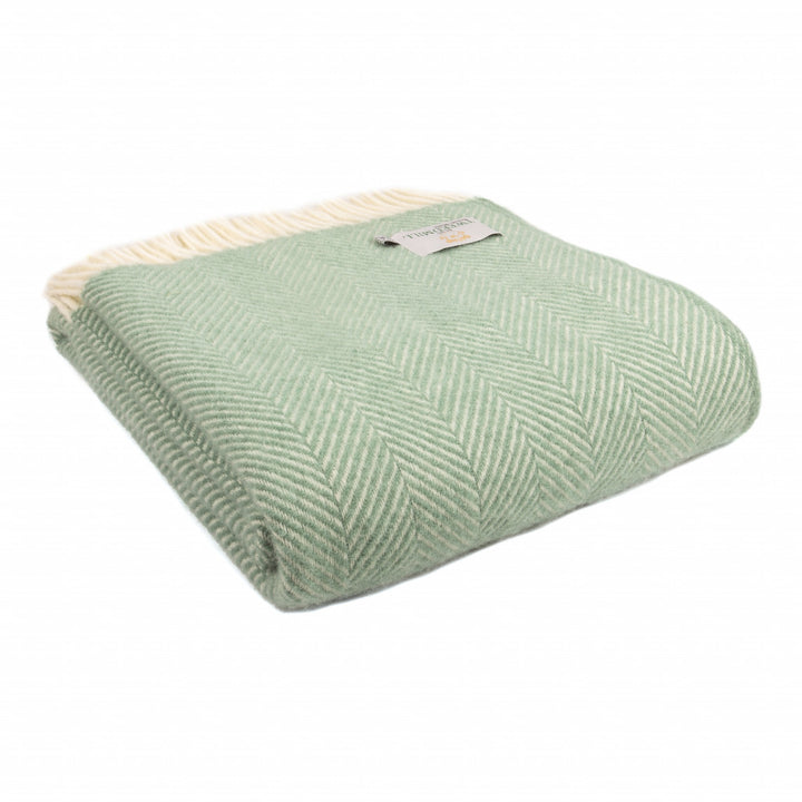 Tweedmill Fishbone Sea Green Blanket with cream tassels, cozy texture, perfect home decor from Source for the Goose, Devon.