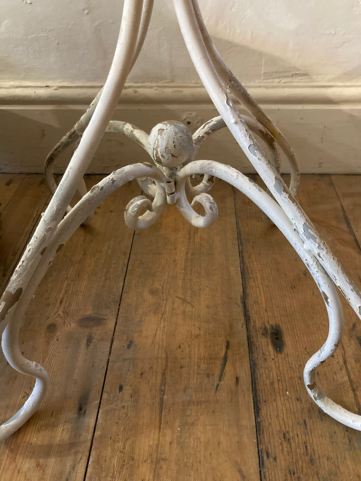 French style metal side table base featuring elegant filigree design and distressed white finish.