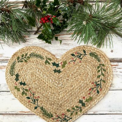 Natural Jute Christmas Heart Placemat with holly and spruce design, perfect for festive decor. Source for the Goose, Devon.