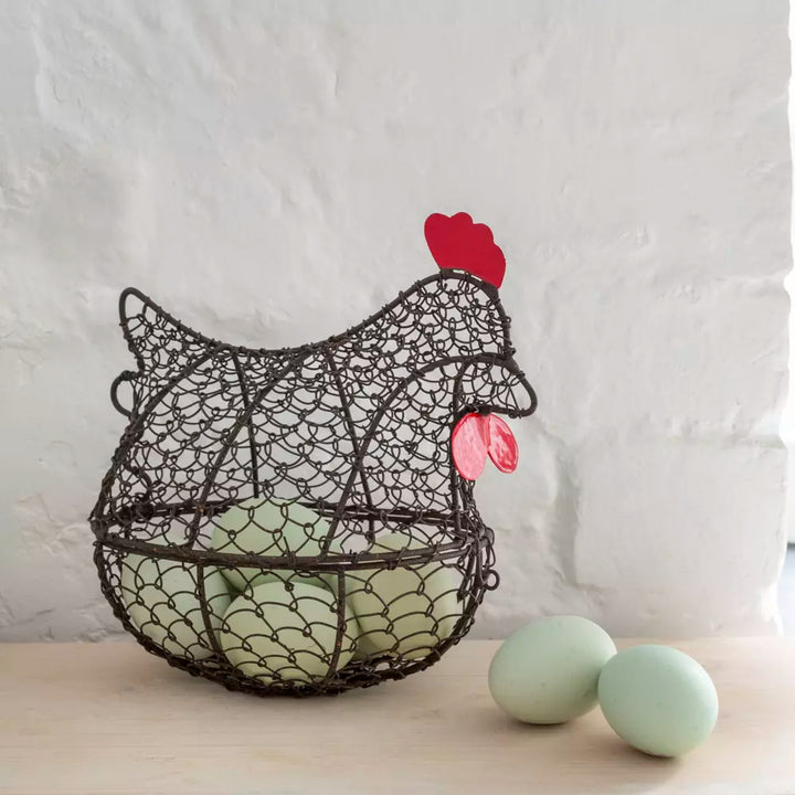 Henrietta wire egg basket chicken-shaped with green eggs, Source for the Goose Devon farmhouse kitchen décor.