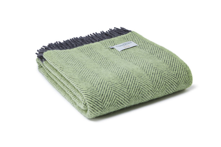 Tweedmill Herringbone Zest Green Wool Blanket with charcoal tassels, perfect for cosy autumn evenings, sold by Source for the Goose, Devon