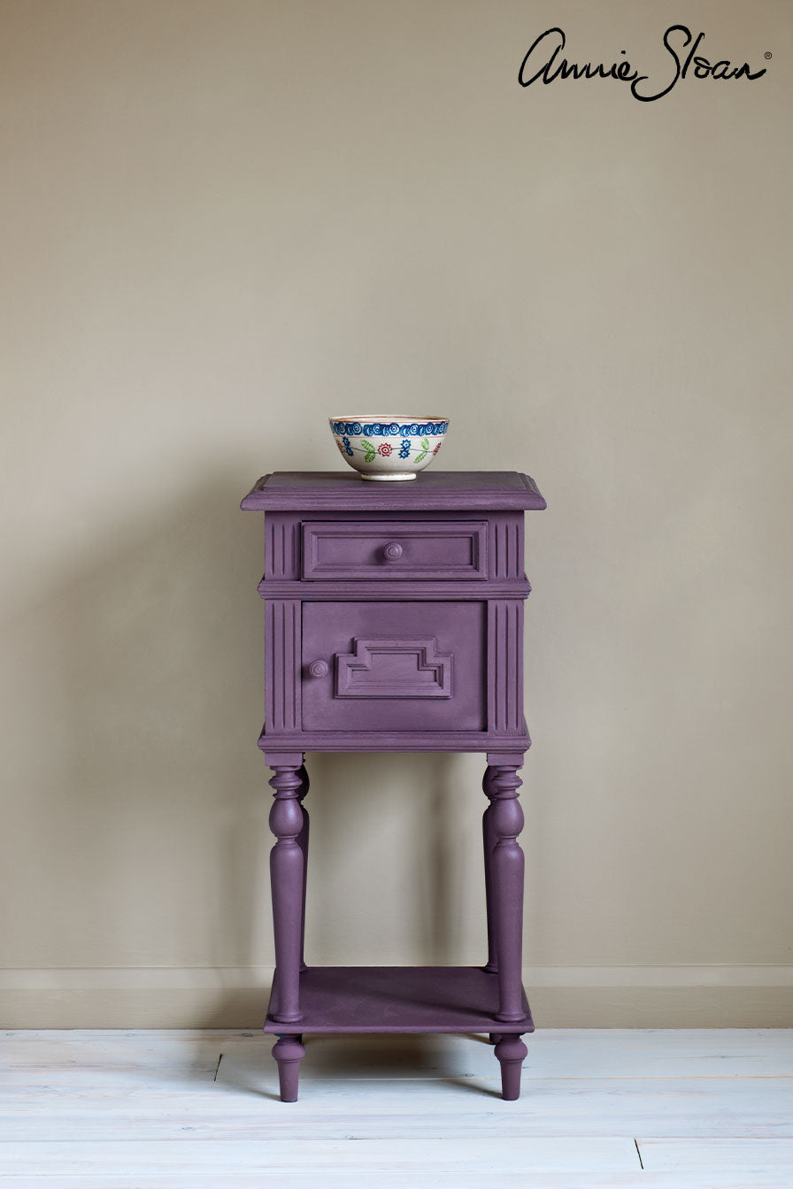 Vintage side table painted in deep Rodmell Chalk Paint, perfect for bohemian interiors, with a decorative bowl on top.