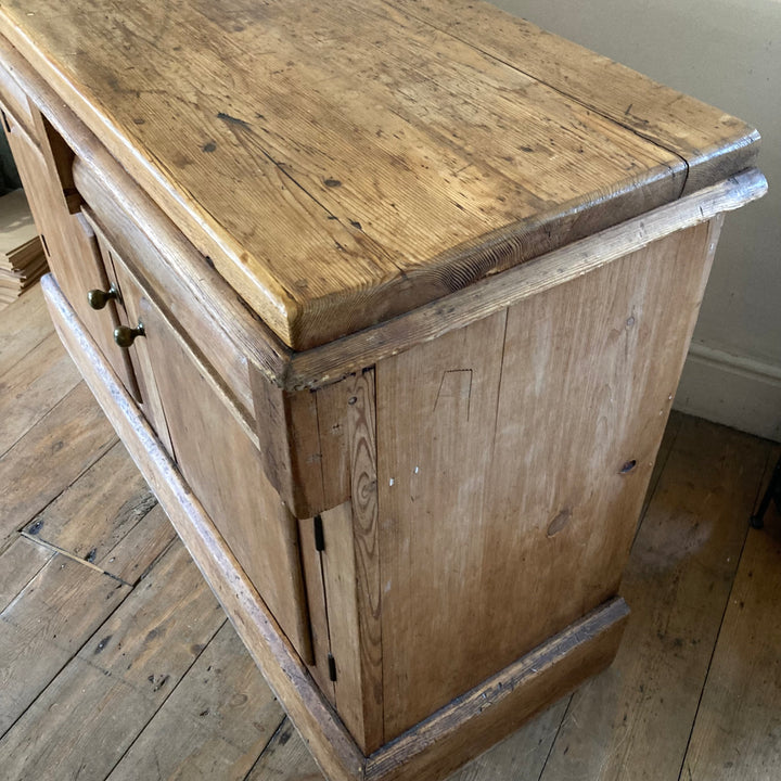 Rustic antique pine sideboard top view featuring brass handles and sturdy design, ideal for charming country decor. Source for the Goose.