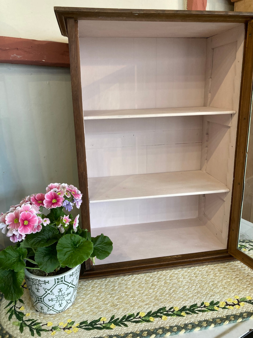 Small vintage glass cabinet with shelves, oak exterior, pink interior, ideal for displaying decor from Source for the Goose, Devon.