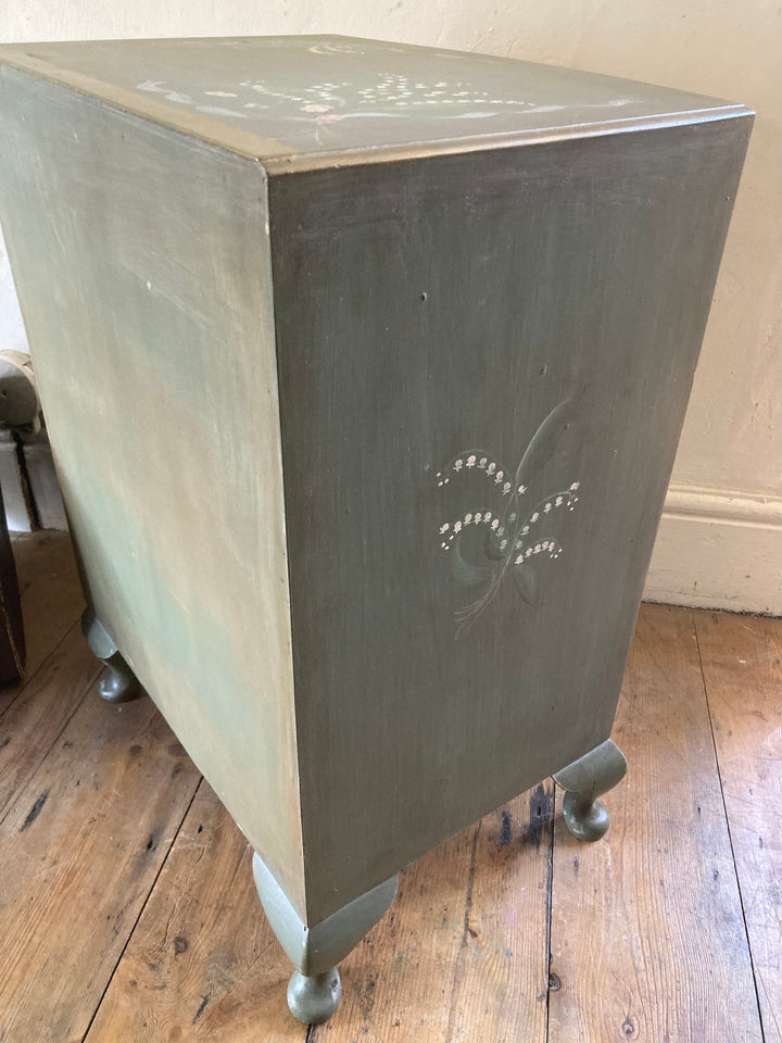 Small chest of drawers with hand-painted flowers, in calming green, featuring French style legs. Source for the Goose, Devon.