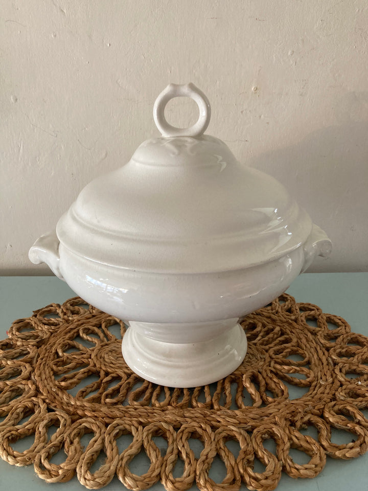 Large Antique White Tureen on a woven placemat, perfect for farmhouse kitchens. Source for the Goose, Devon.