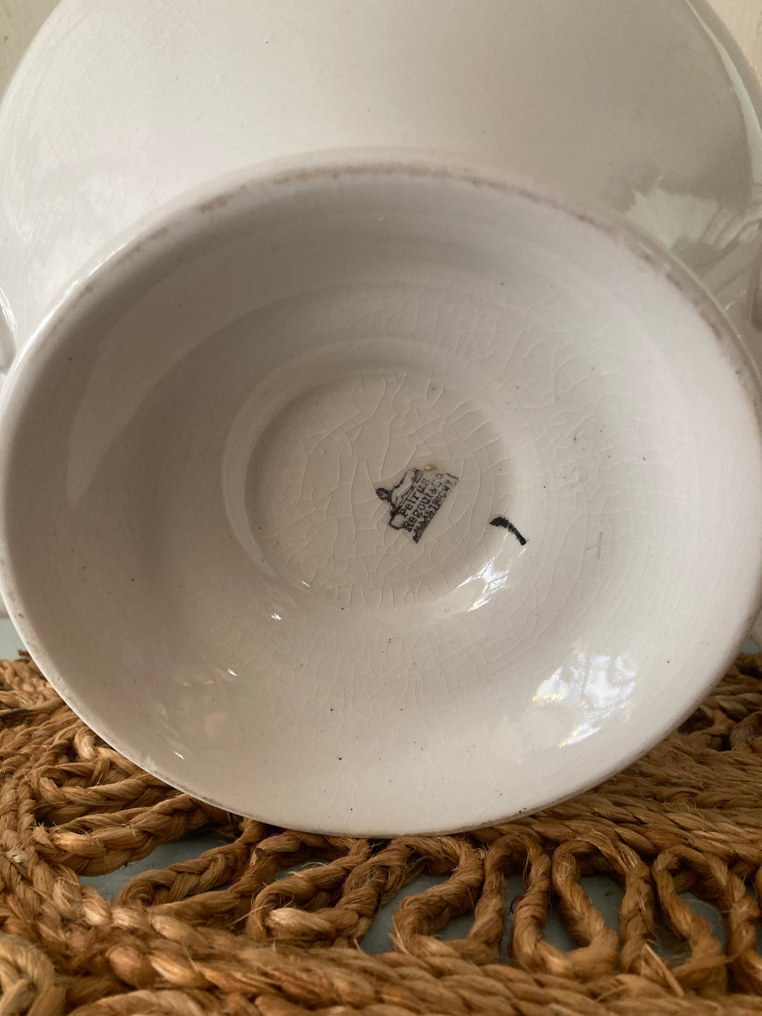 Underside of a Large Antique White Tureen by Petrus Regout, showcasing the hallmark on the ceramic surface.