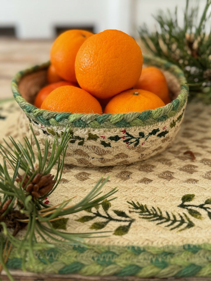 Christmas Jute Mini Basket with satsumas, featuring holly design, from Source for the Goose Devon, festive decor setting.