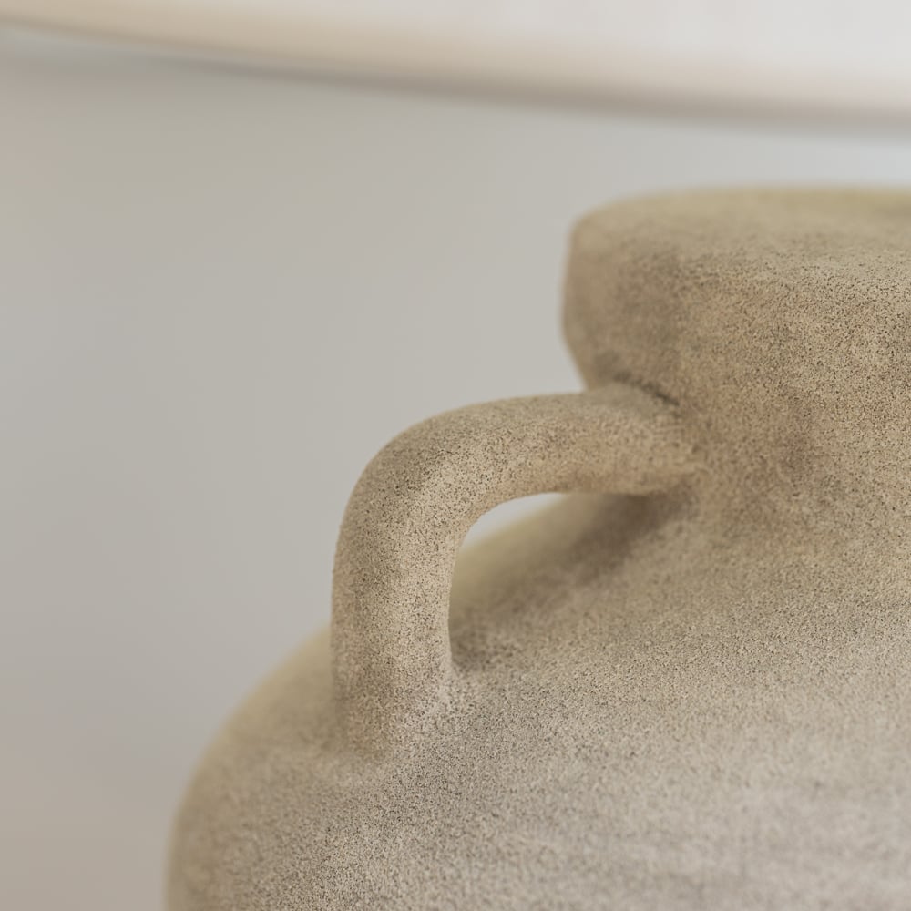 Close-up of sandy textured Stoneware Amphora Lamp from Source for the Goose, Devon, showcasing the handle and part of the conical shade