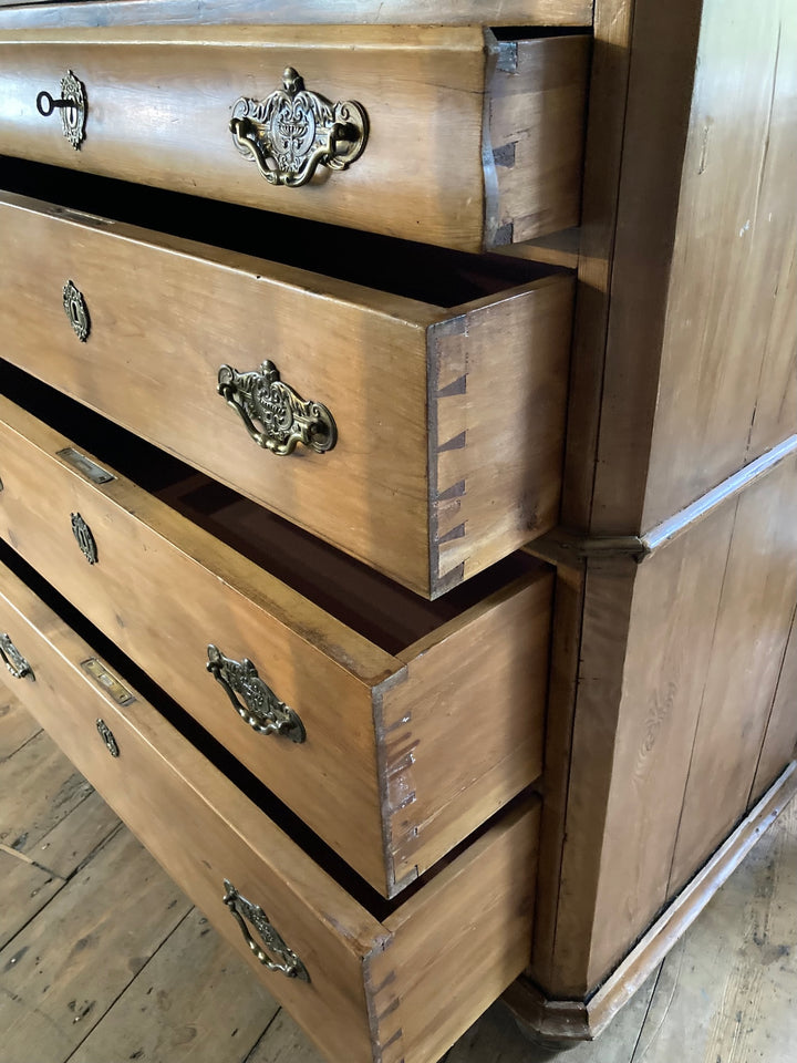 Close-up of the Antique Pine French Linen Press showcasing detailed brass handles and handcrafted drawers.