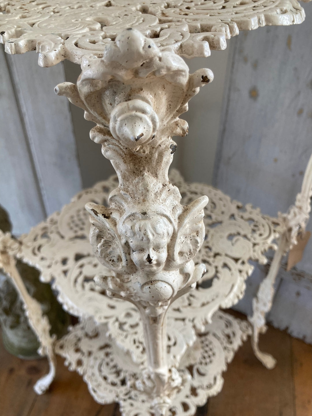 Antique White Cast Iron Plant Stand with intricate filigree design, perfect for vintage home decor. Source for the Goose, Devon.