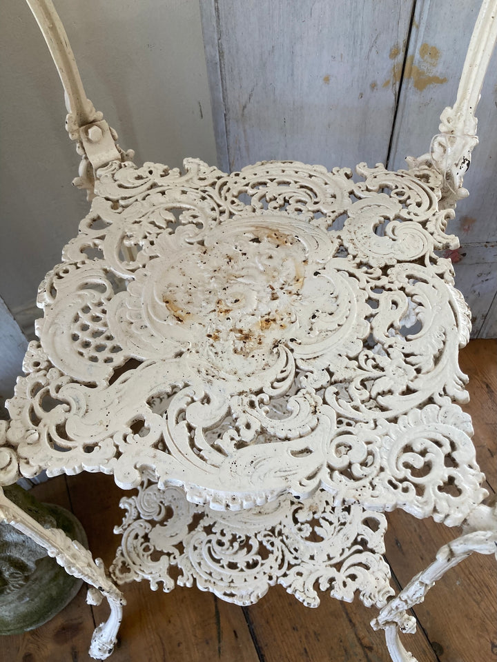 Top view of antique white cast iron plant stand featuring intricate filigree design from Source for the Goose, Devon.