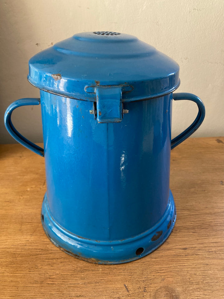 Vintage blue enamel bucket with lid and handles, featuring rustic charm for kitchen storage. Source for the Goose, Devon.