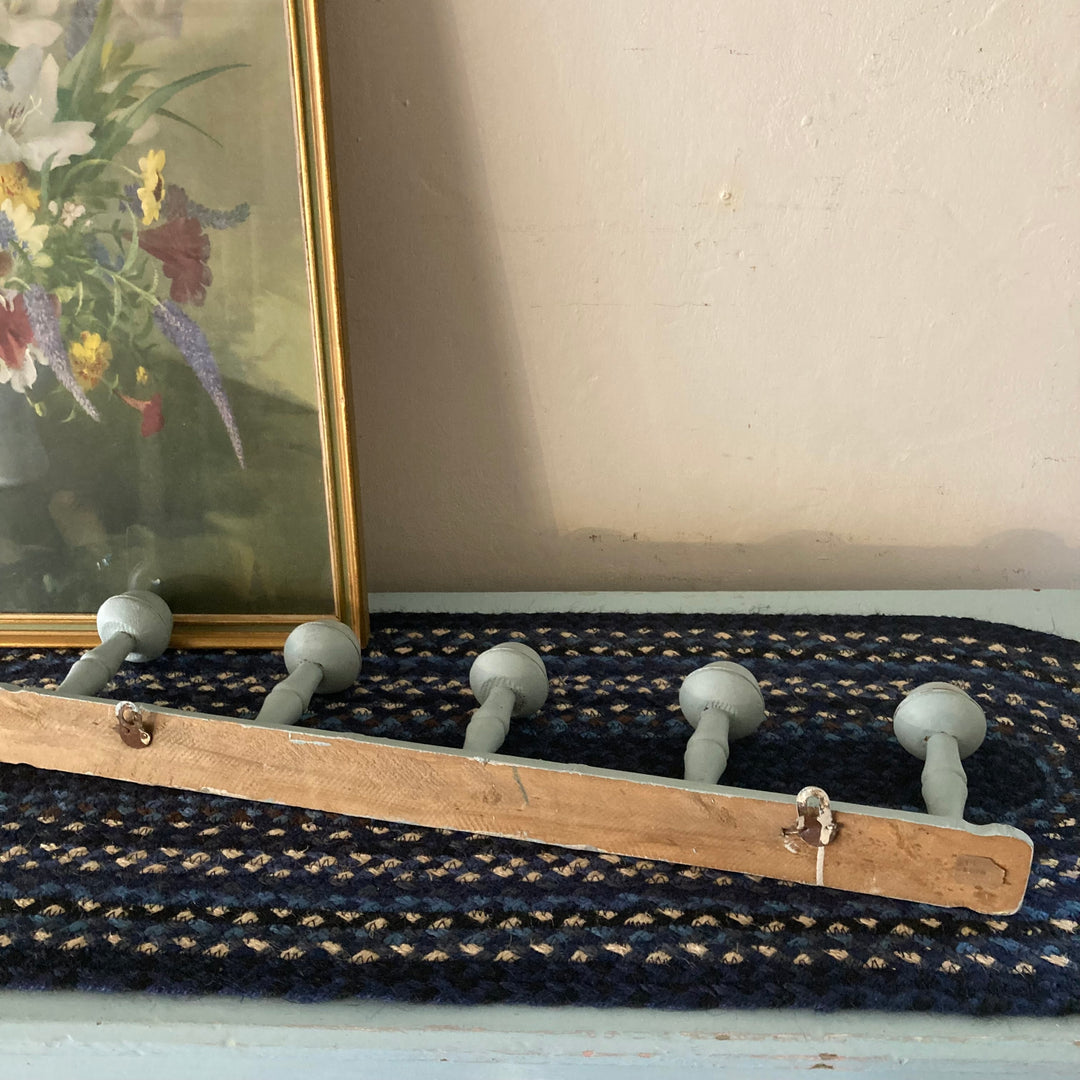 Blue Painted Faux Bamboo Coat Hooks on rustic wooden rail from Source for the Goose, Devon, adding vintage style.