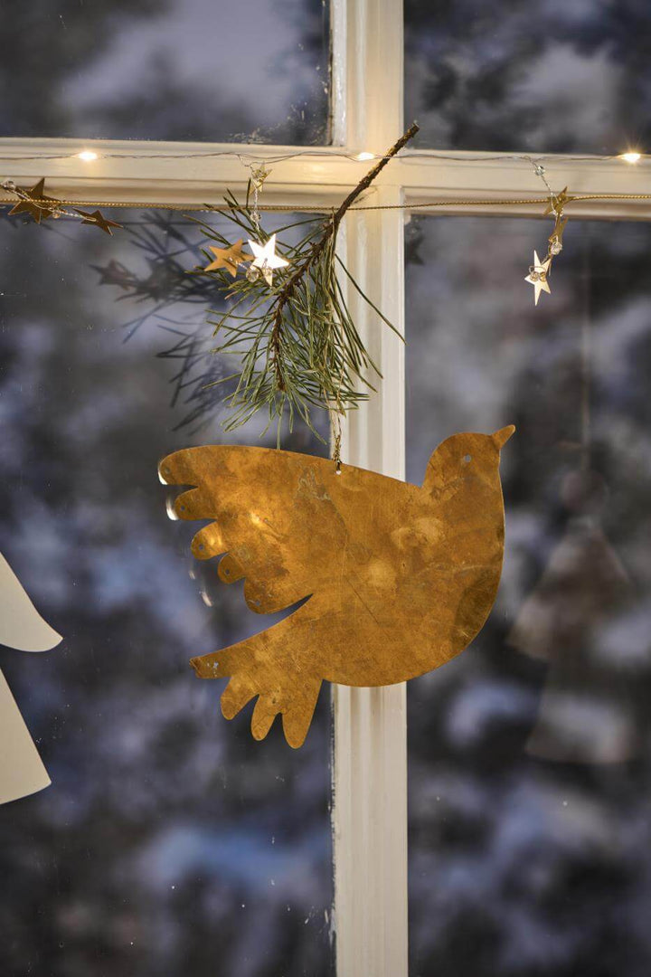 faux brass dove suspended from rustic twine and leds for a pretty display