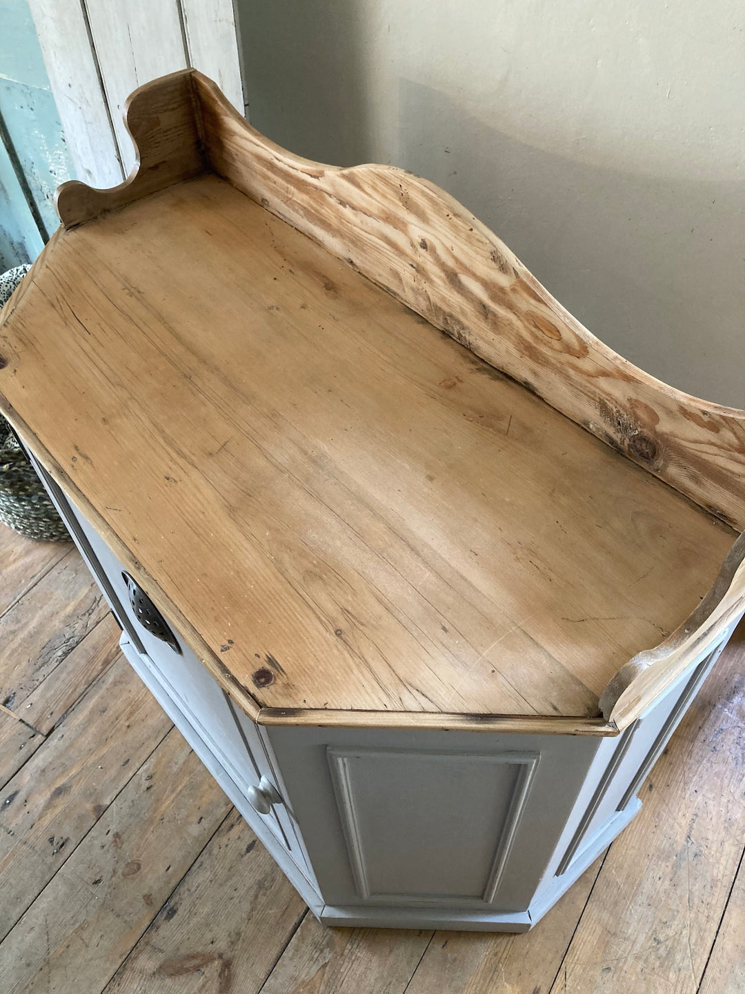 Top view of a Vintage Pantry Cupboard with a pine top and soft grey paint, showcasing charming design for kitchen storage.