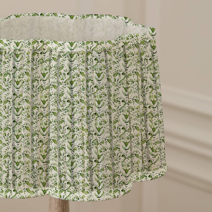 Juna pleated scalloped lamp shade in sage green with floral watercolor design for elegant home decor. Source for the Goose, Devon.