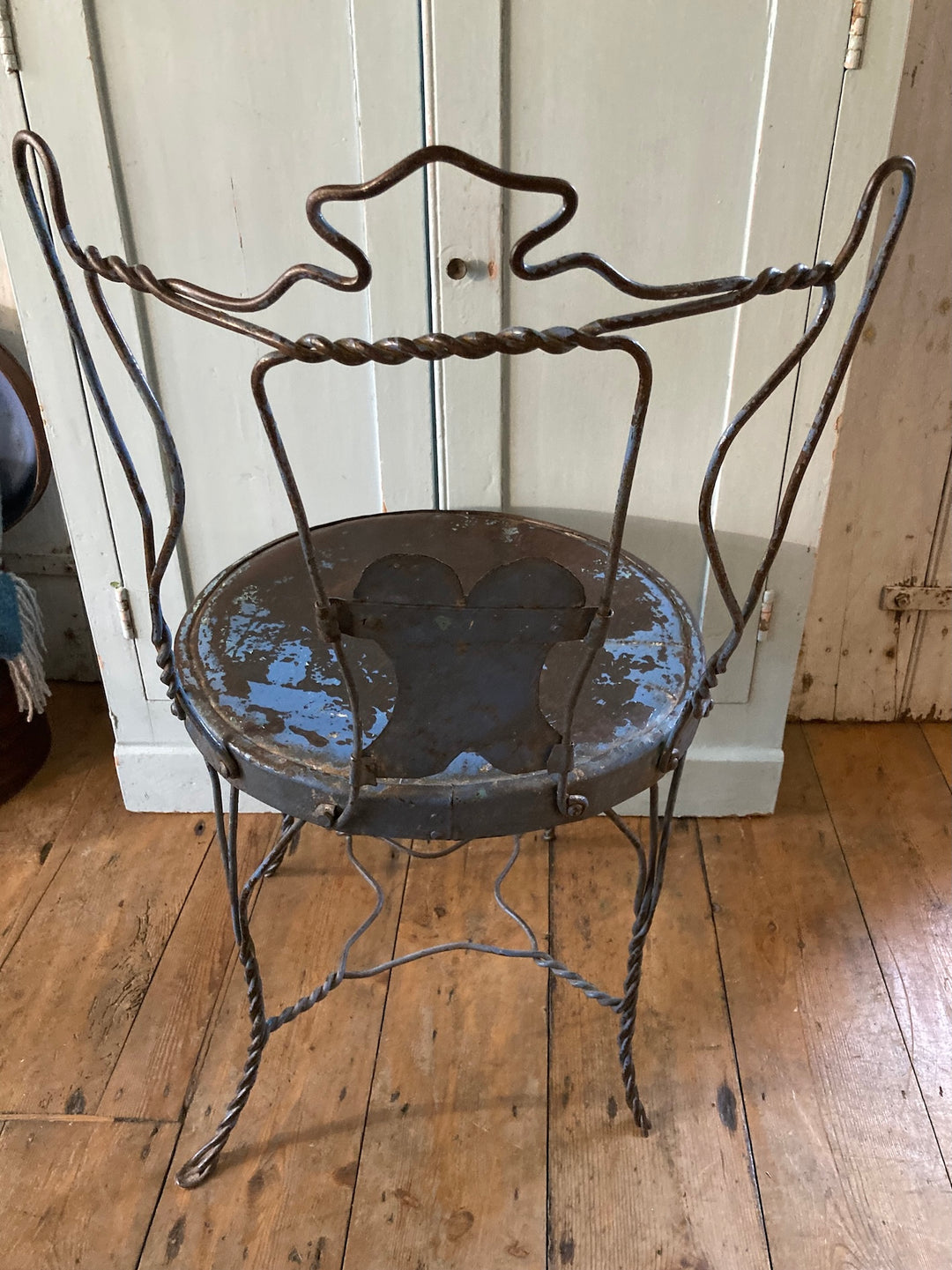 Handmade Metal Bistro Chair with chippy blue paint and twisted metal frame for rustic French design charm from Source for the Goose Devon.