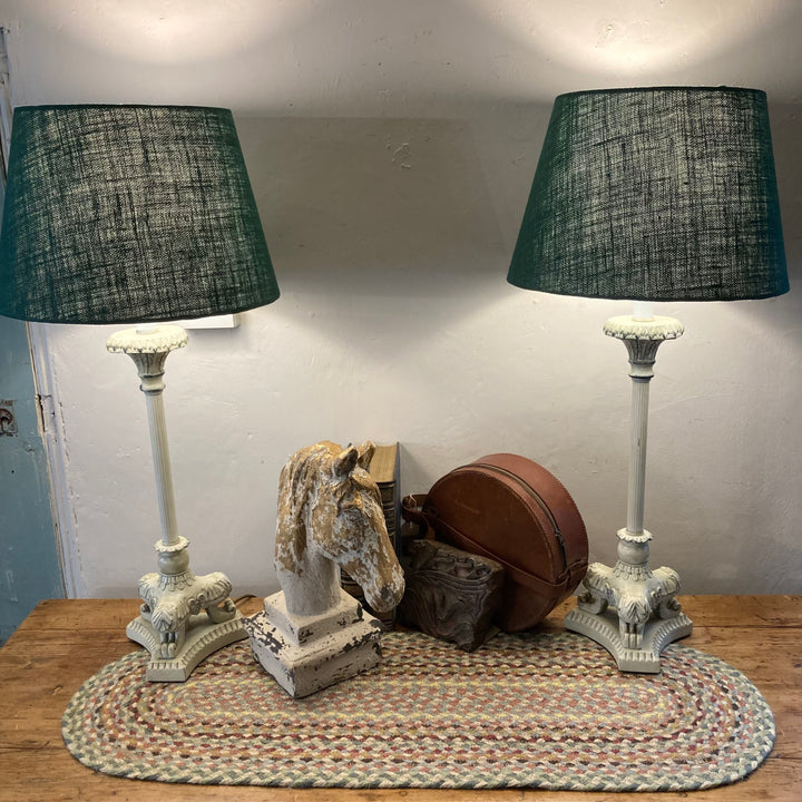 Pair of cream metal base lamps with green shades, featuring a decorative horse bust and vintage accessories. Source for the Goose Devon.