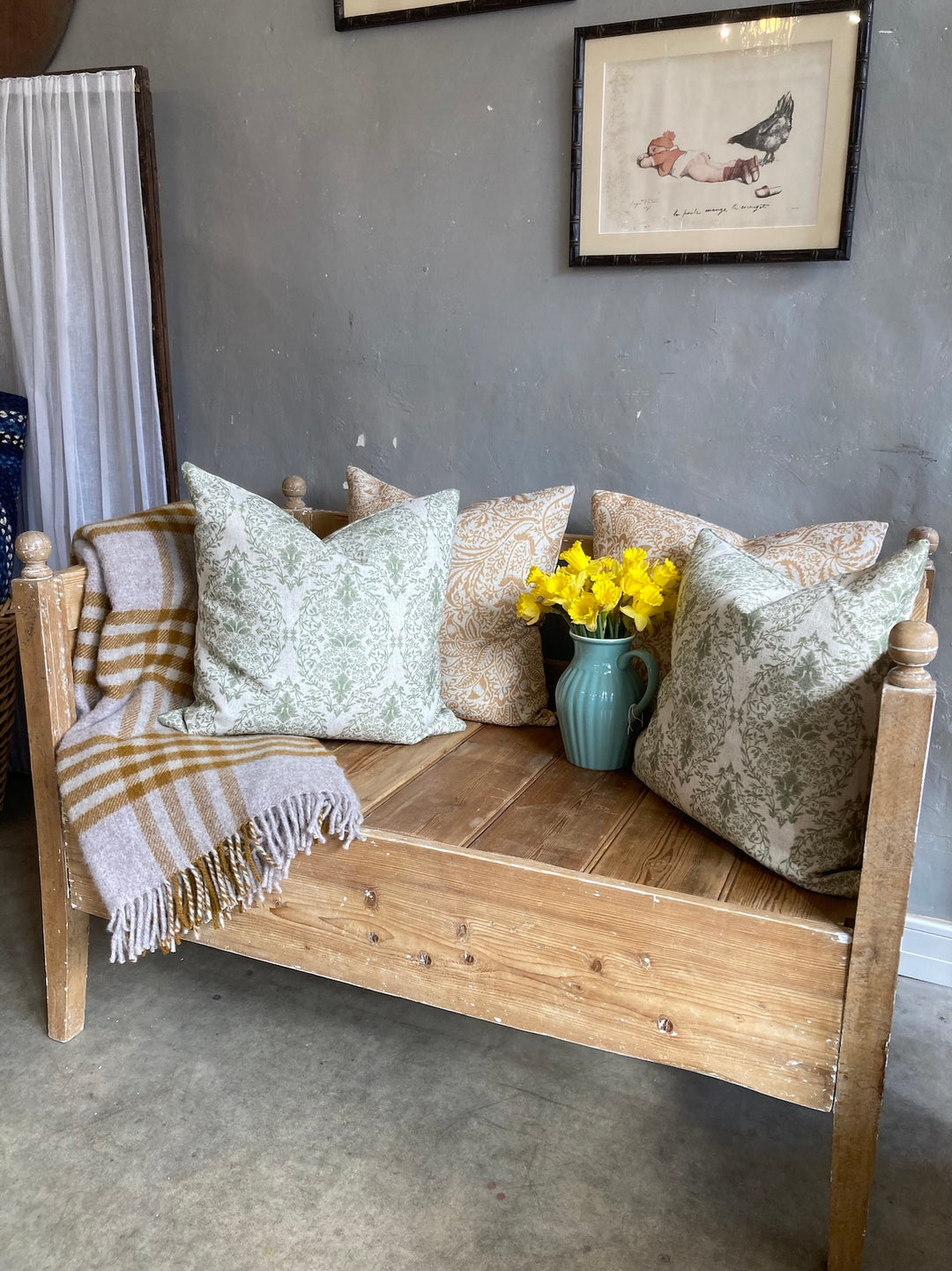 Vintage Pine Bench Seat styled with cushions, throw blanket, and flowers, enhancing rustic decor by Source for the Goose, Devon.