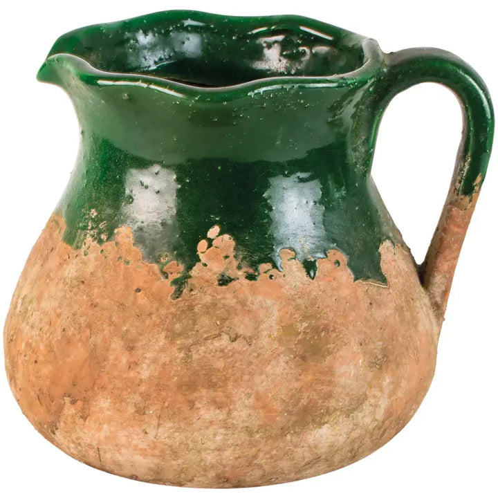 Rustic green terracotta jug with vintage charm, featuring a rich green glaze, earthy base, sturdy handle, and spout for decorative or practical use.