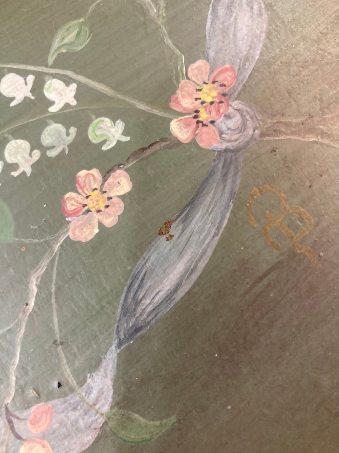 Close-up of hand-painted flowers on a small chest of drawers, showcasing delicate floral details by Source for the Goose, Devon.