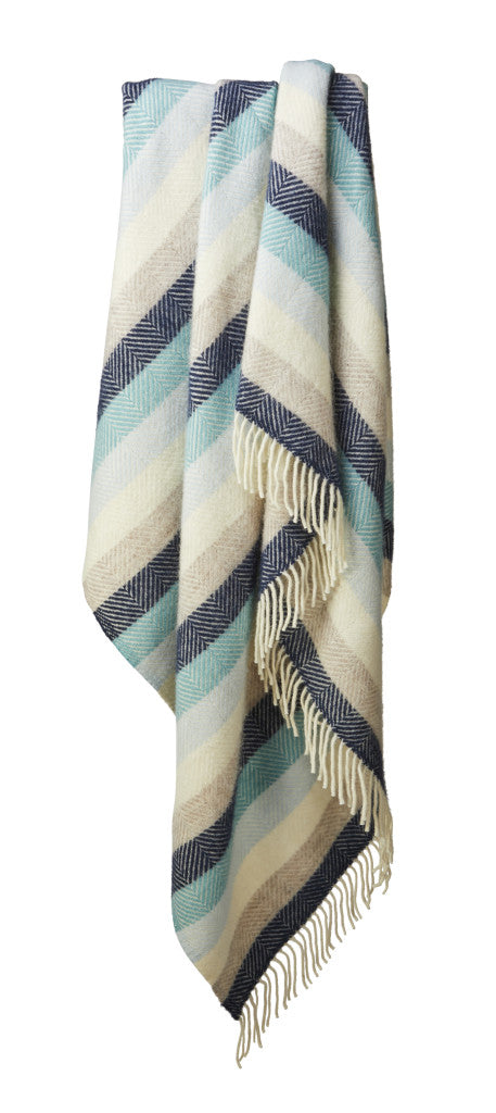 Tweedmill Botanical Green Stripe Pure Wool Throw with cream tassels, adding warmth and style to any room. Source for the Goose Devon.