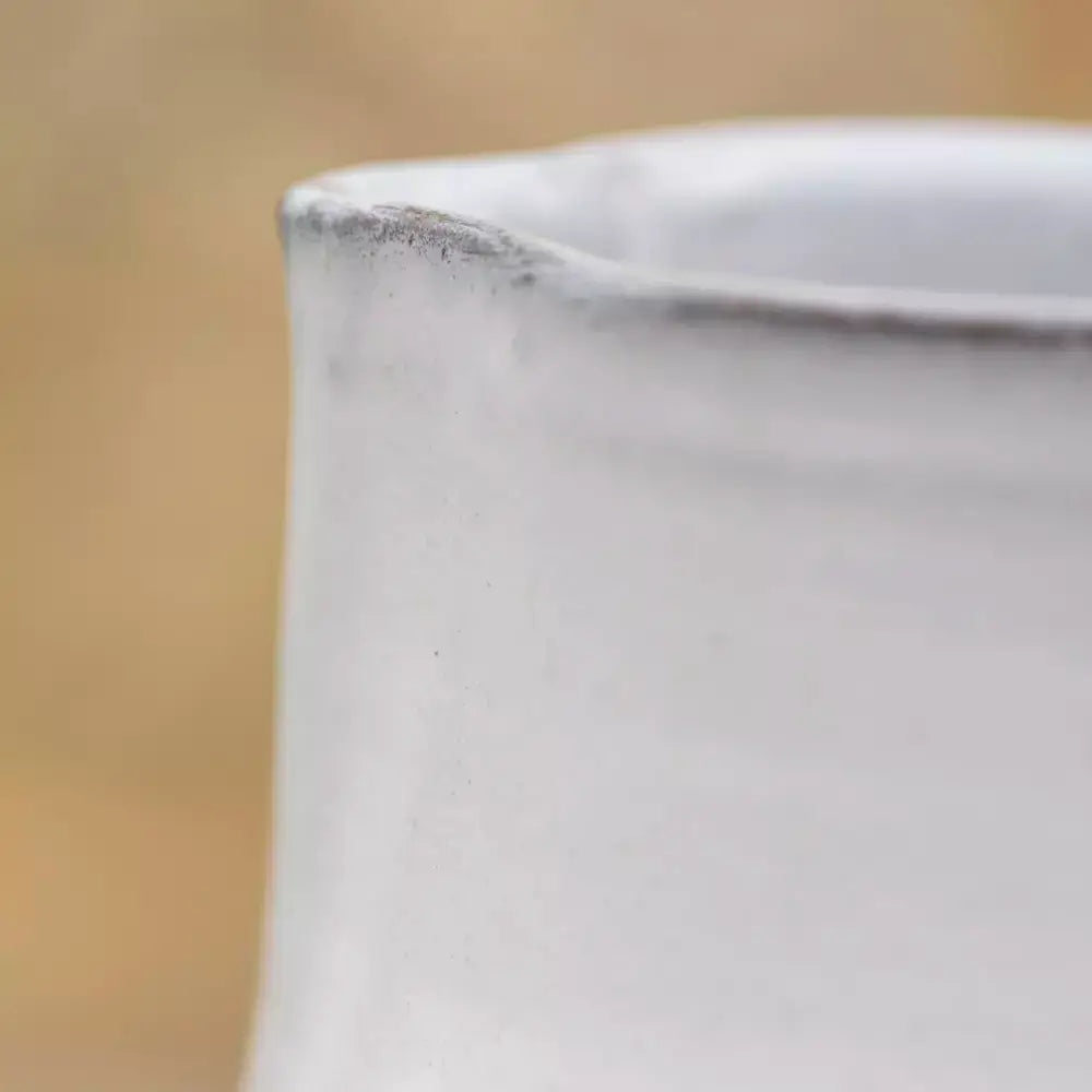 Close-up of a Vintage Style Glazed White Jug showing the rustic detailing and traditional white ceramic glaze.