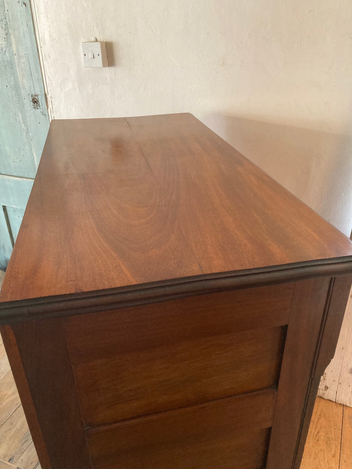 Elegant view of the top of a Tall Two over Three Edwardian Chest of Drawers, showcasing its antique wood finish.