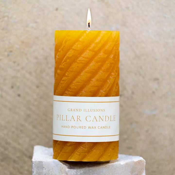 Twisted Warm Ochre Pillar Candle by Source for the Goose, featuring a hand-poured wax design and elegant glow.